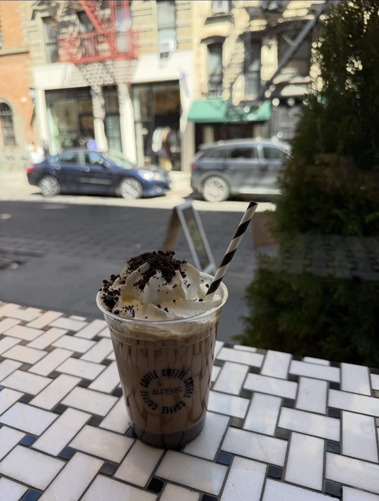 Alden's Oreo latte by the window