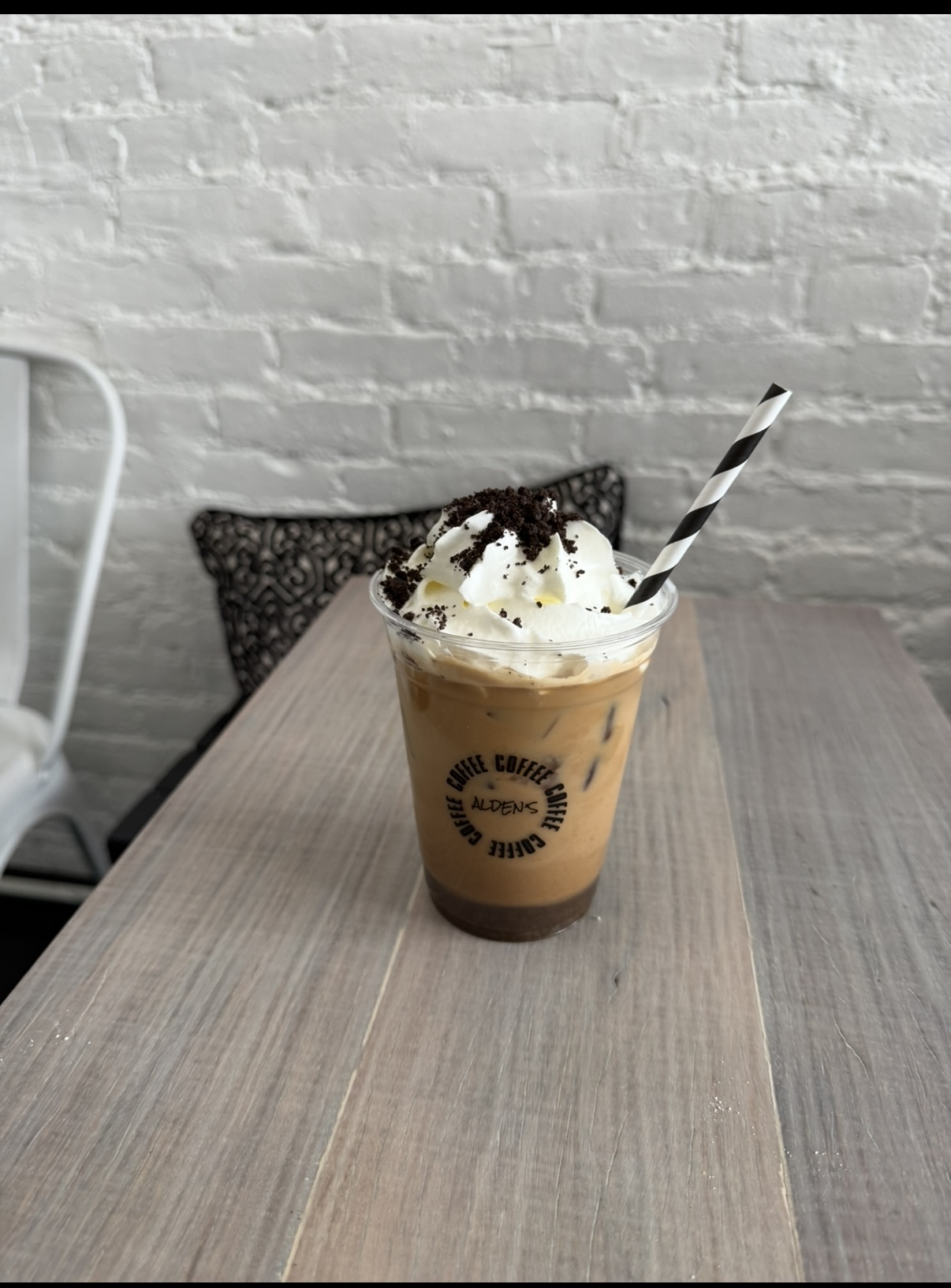 Oreo latte with cream and cookie crumb